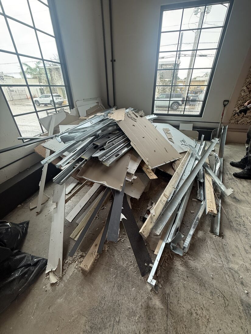 Interior demolition debris piled and ready for removal