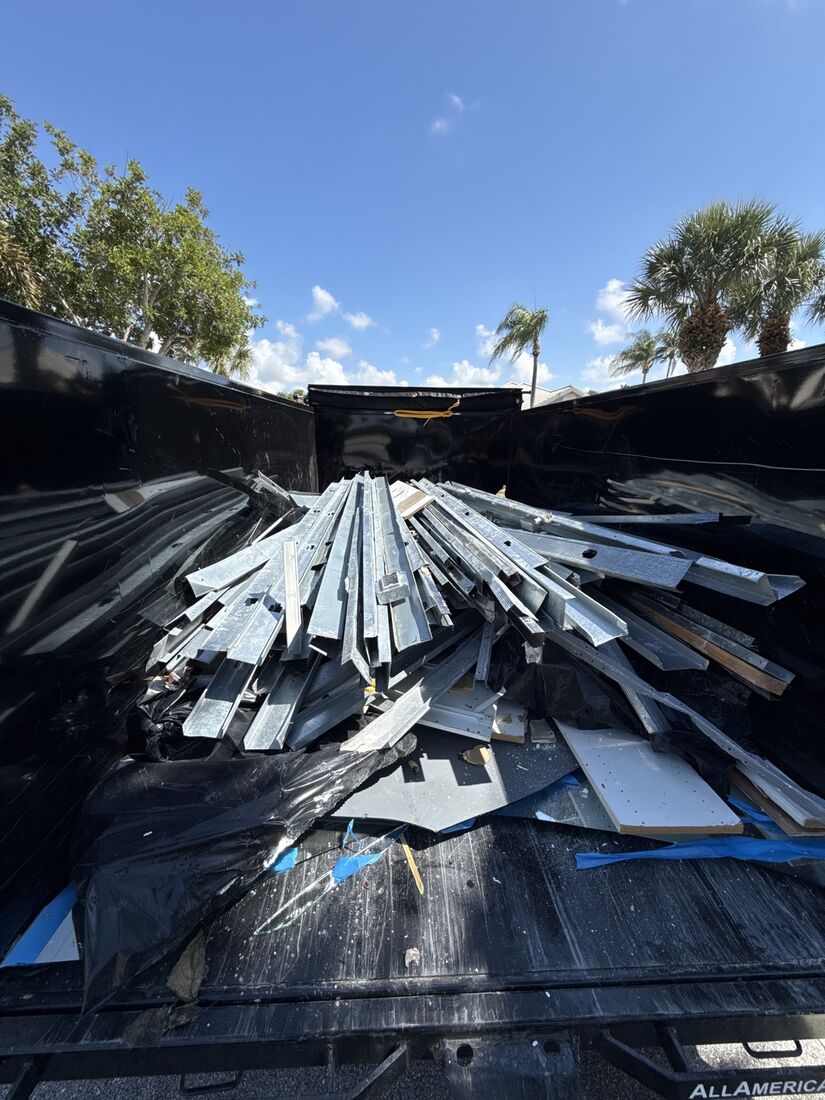 Dump trailer full of metal studs and framing scrap